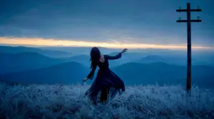 Windblown Woman on Misty Mountain