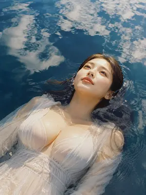 Woman Floating in Reflective Water