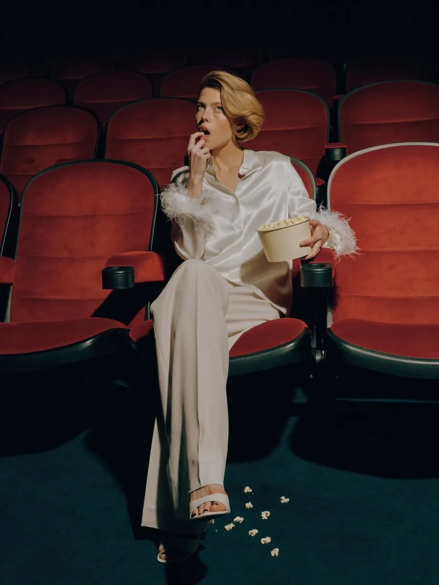Elegant Fashion Editorial in a Dark Movie Theater reference