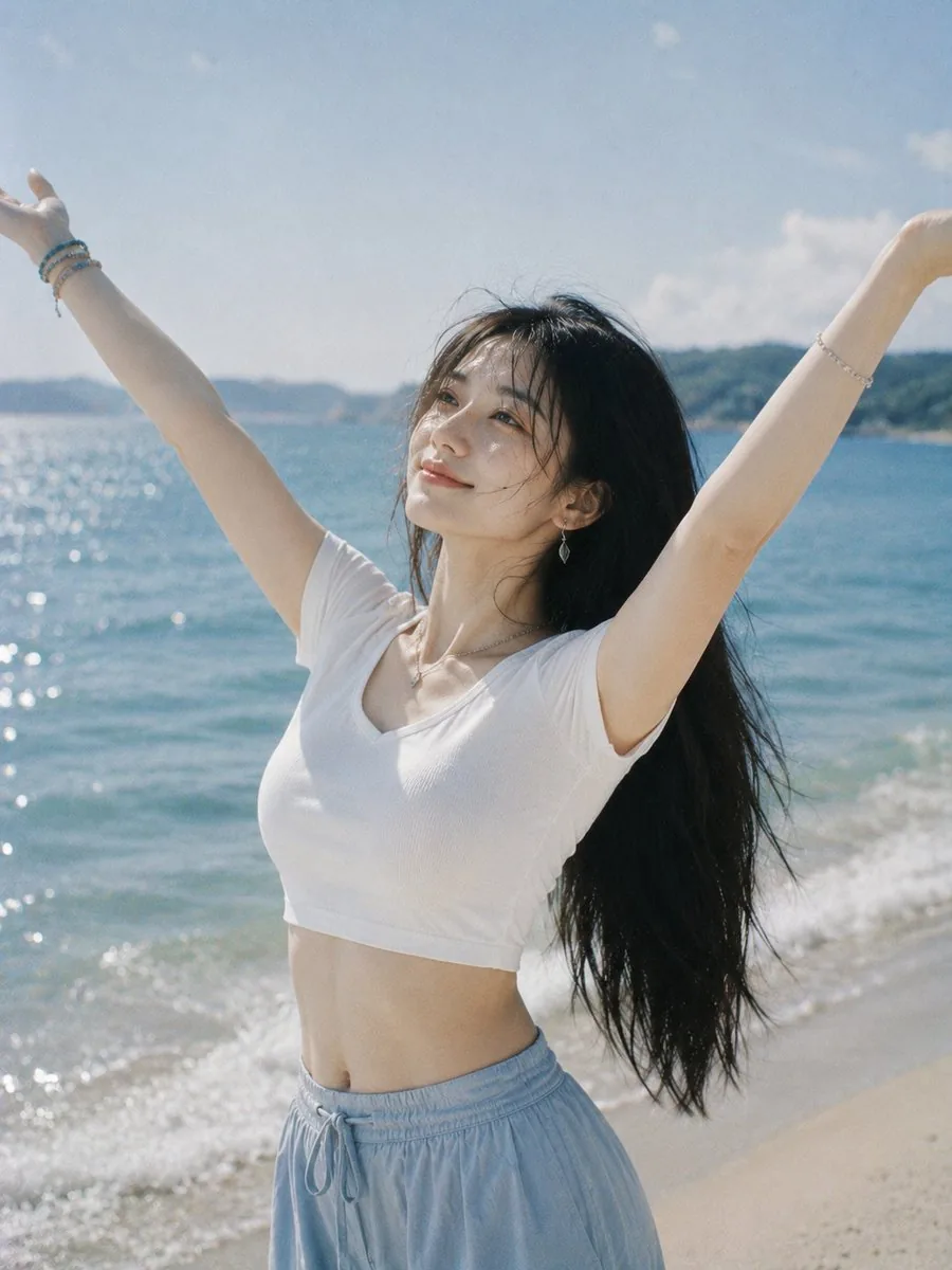 Joyful Woman Raising Arms at Beach reference