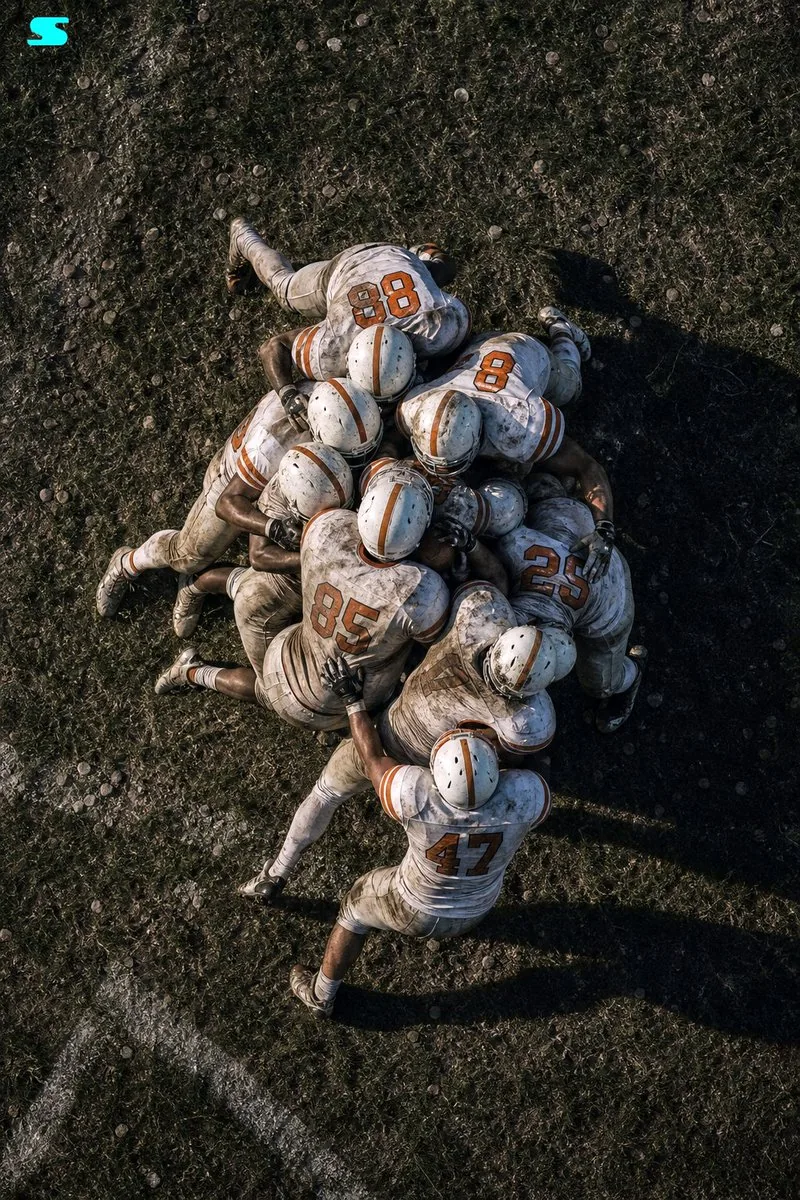 Aerial American Football Huddle reference