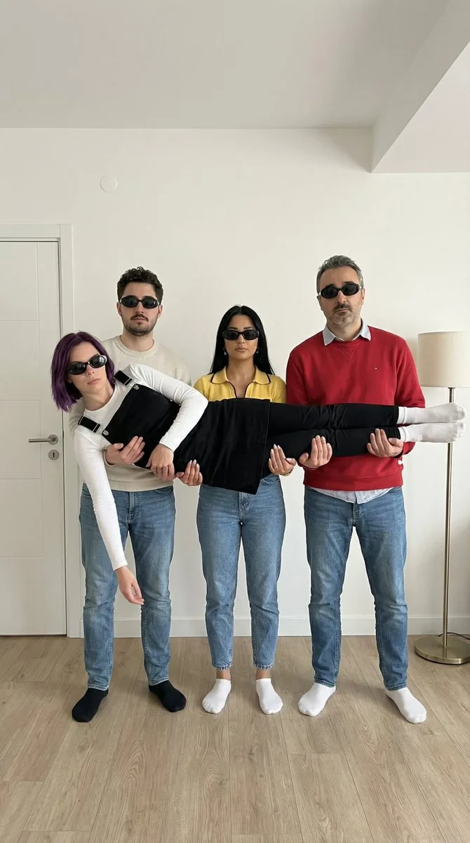 Four-Person Identity-Locked Group Pose Prompt - Nano Banana Pro AI Prompt for Social Media Post reference