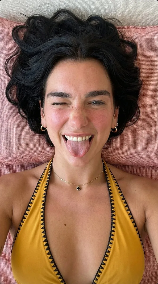 Playful Overhead Portrait with Winking Expression Prompt (Black Hair) - Nano Banana Pro AI Prompt for Social Media Post reference