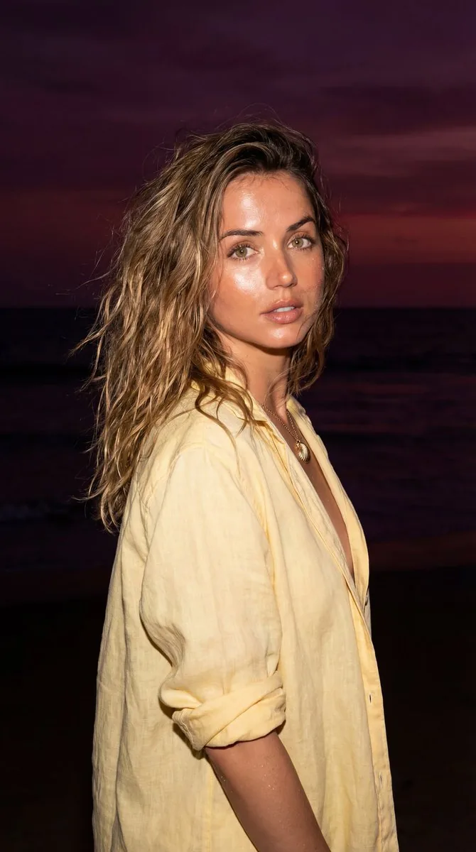 Late-Night Coastal Portrait with Flash and Sunset Glow reference