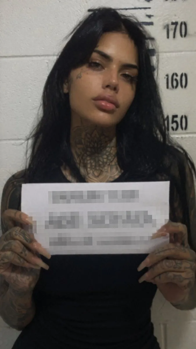 Gritty Tattooed Woman Mugshot reference