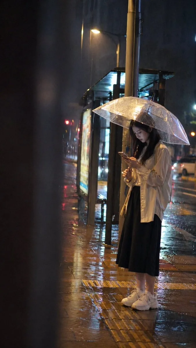 Cinematic rainy night bus stop prompt reference