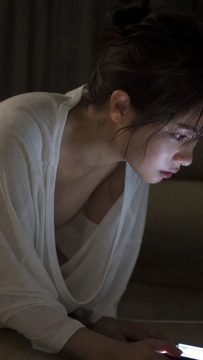 Moody Woman Looking at Phone reference
