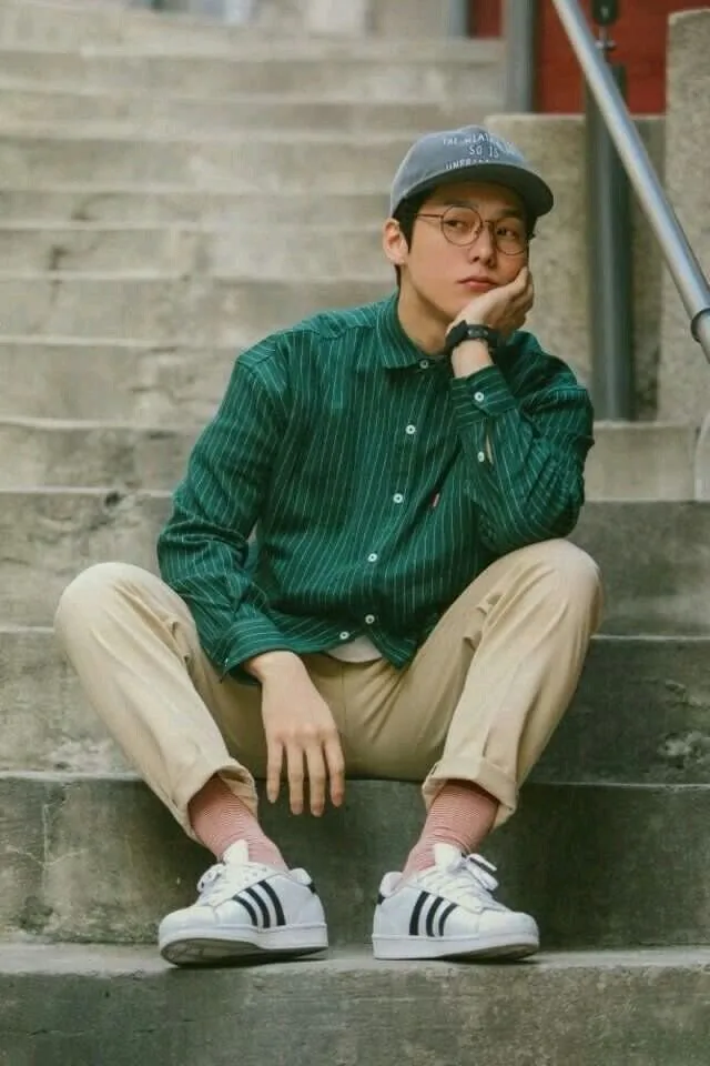 Introspective Young Man on Concrete Stairs reference